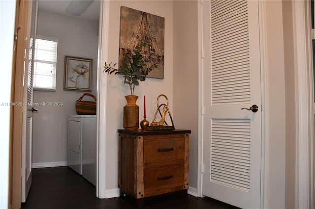 hallway with washing machine and dryer and dark wood-type flooring