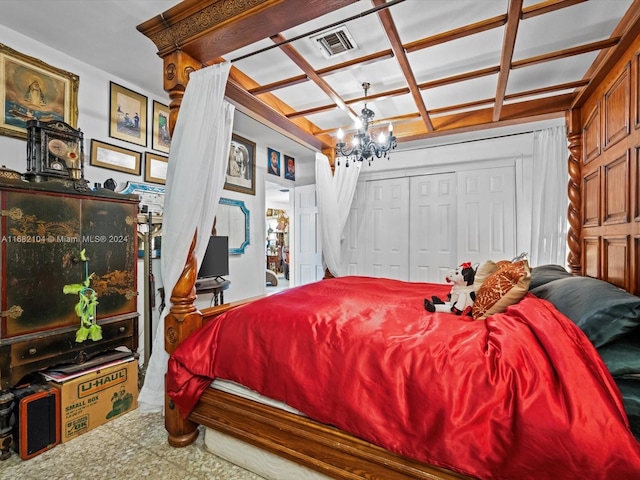 bedroom featuring a closet and an inviting chandelier