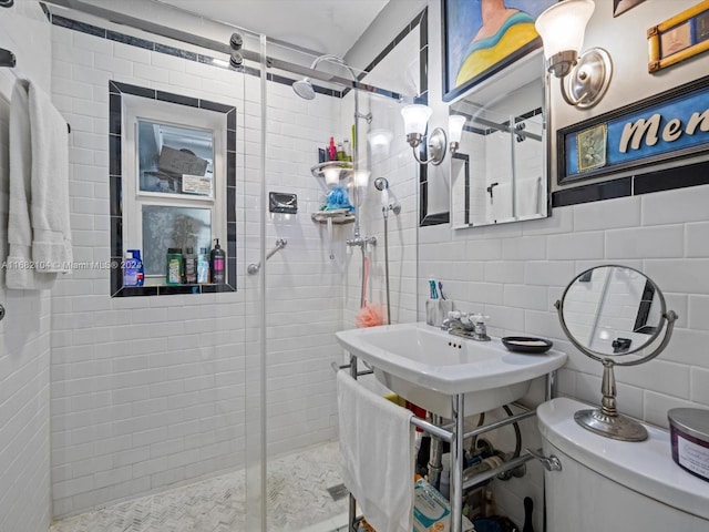 bathroom with toilet, walk in shower, backsplash, and tile walls