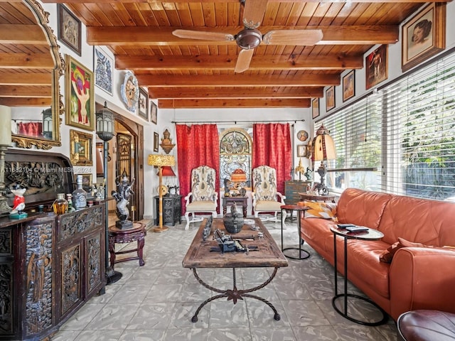 living room featuring beamed ceiling, tile patterned floors, wood ceiling, and ceiling fan