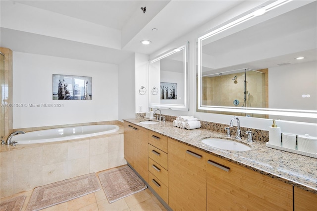 bathroom with vanity, plus walk in shower, and tile patterned flooring