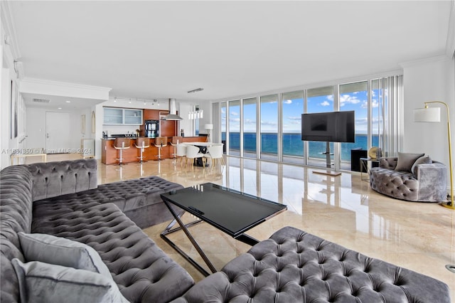 living room featuring crown molding and floor to ceiling windows