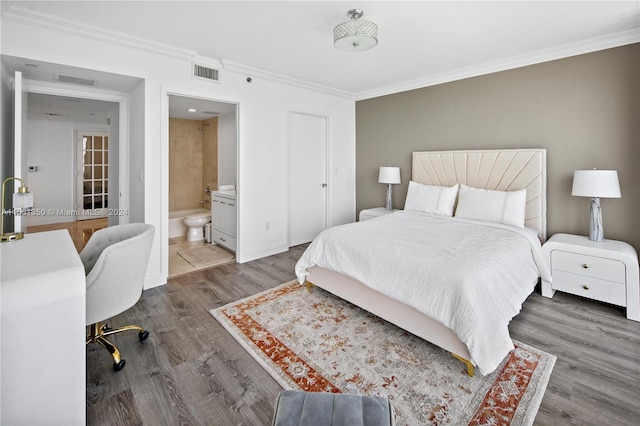 bedroom featuring ensuite bath, ornamental molding, and dark hardwood / wood-style flooring