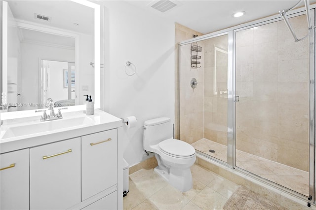 bathroom with vanity, toilet, tile patterned flooring, and an enclosed shower