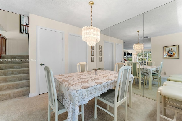 carpeted dining room with a chandelier