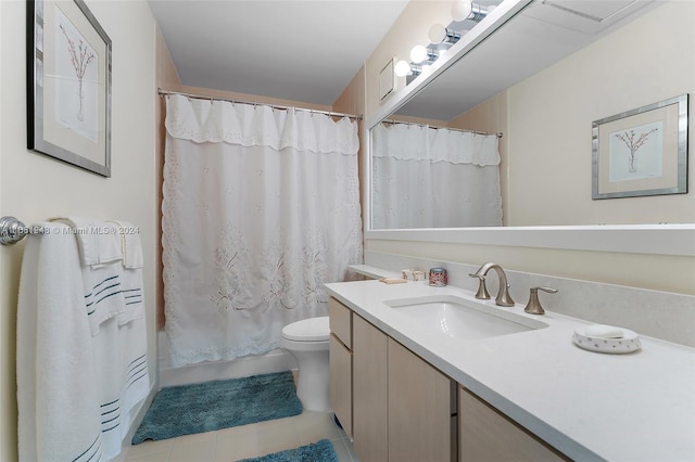 bathroom featuring vanity, a shower with curtain, toilet, and tile patterned floors