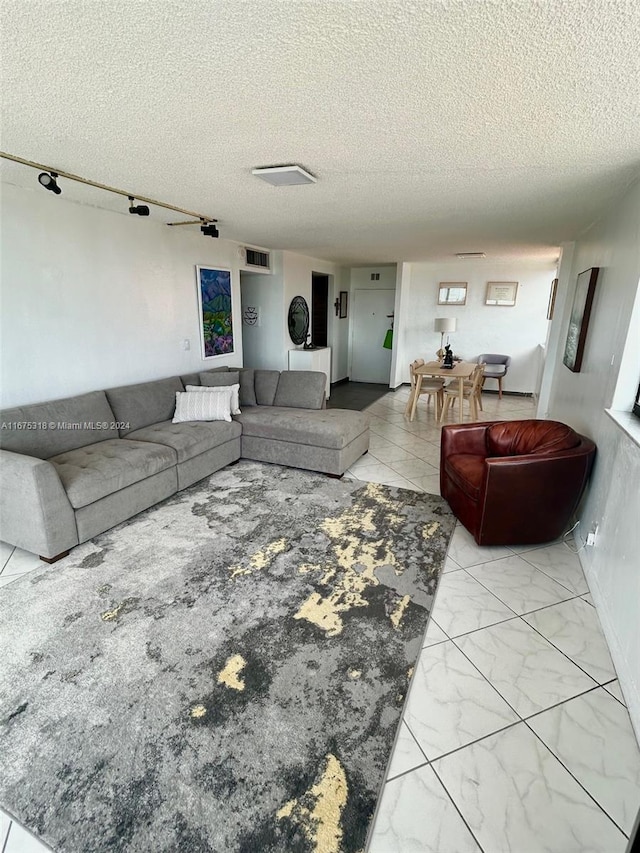 living room featuring a textured ceiling