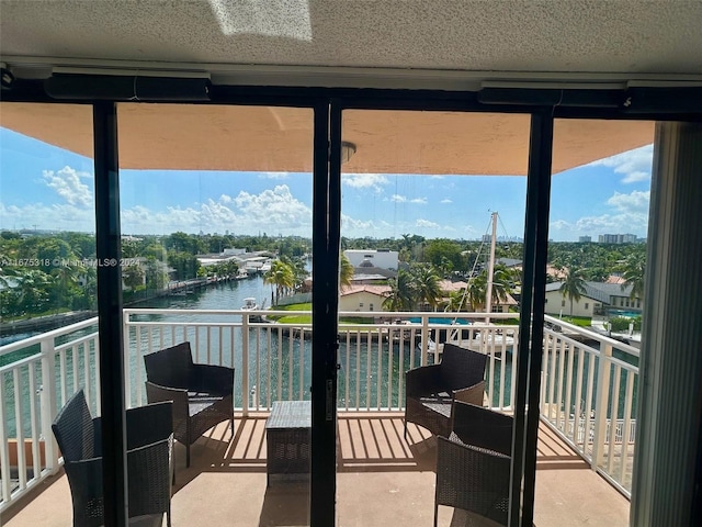 balcony featuring a water view