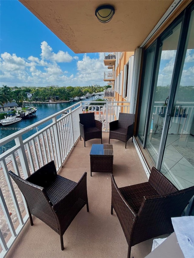 balcony featuring a water view