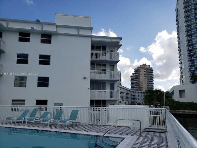 view of pool with a water view