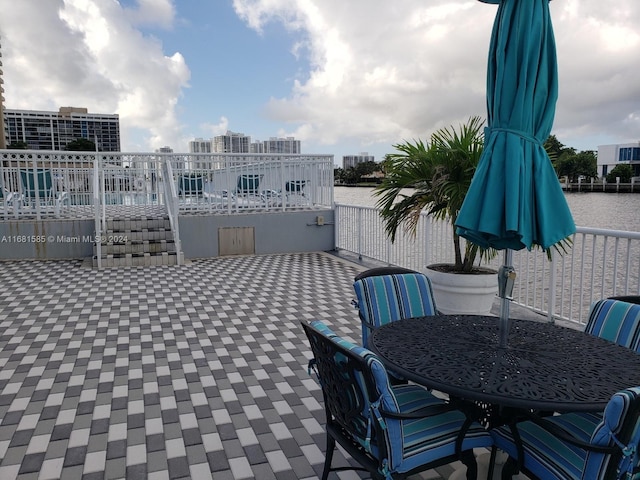 view of patio with a water view