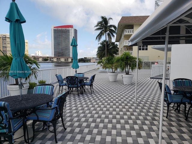 view of patio with a water view