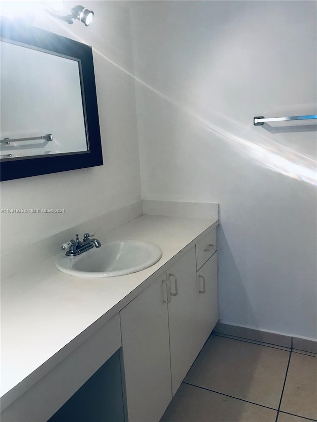 bathroom with vanity and tile patterned floors