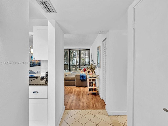 hallway featuring light hardwood / wood-style flooring