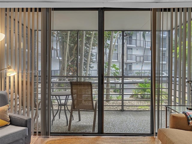 doorway to outside featuring wood-type flooring and plenty of natural light