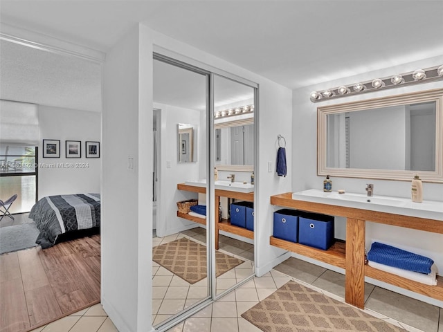 bathroom with vanity and hardwood / wood-style floors