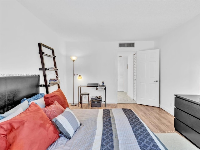 bedroom featuring light hardwood / wood-style floors