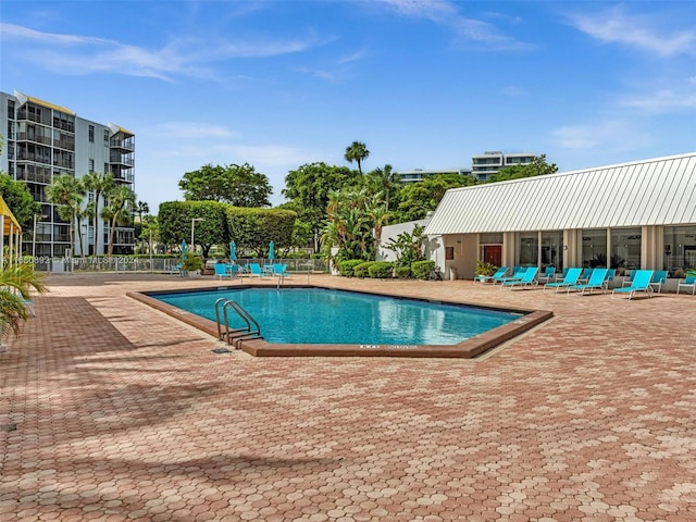 view of swimming pool with a patio area