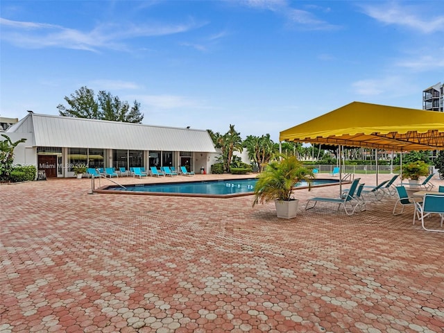 view of swimming pool with a patio