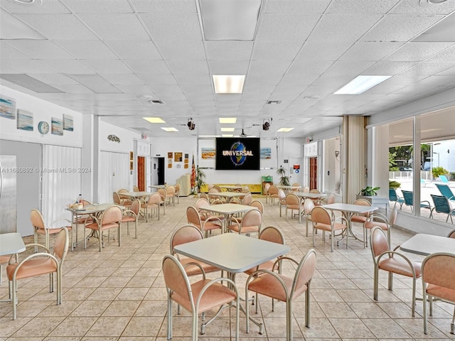 dining room with a paneled ceiling