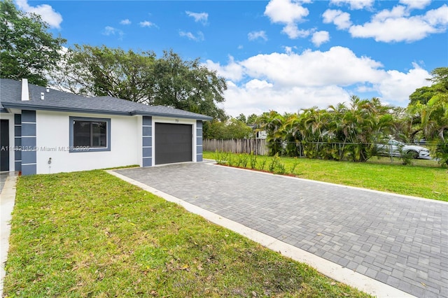 garage featuring a lawn