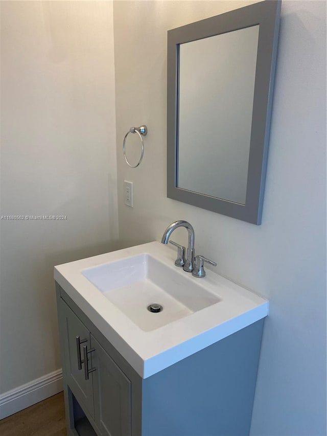 bathroom featuring vanity and wood-type flooring