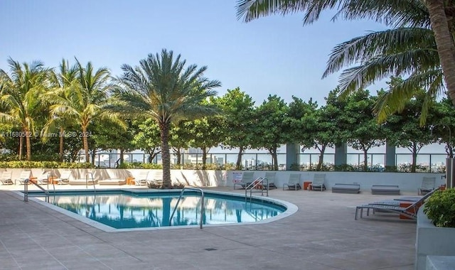 view of swimming pool with a patio