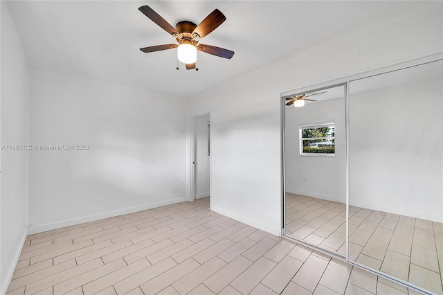 unfurnished room with ceiling fan