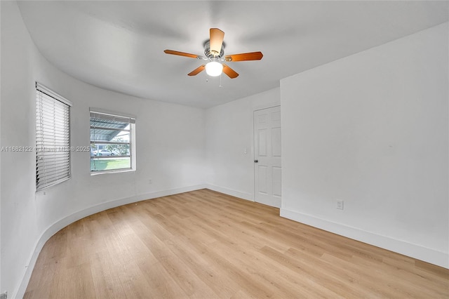 empty room featuring light hardwood / wood-style floors and ceiling fan