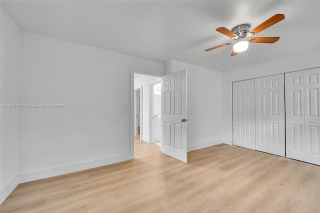 unfurnished bedroom with a closet, light hardwood / wood-style flooring, and ceiling fan