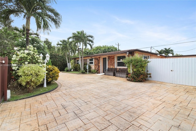 ranch-style home with a patio