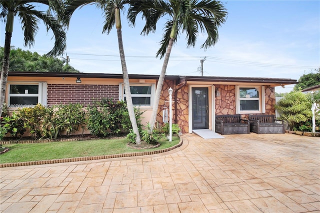 ranch-style house with a patio