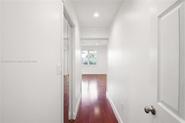 corridor featuring dark hardwood / wood-style floors