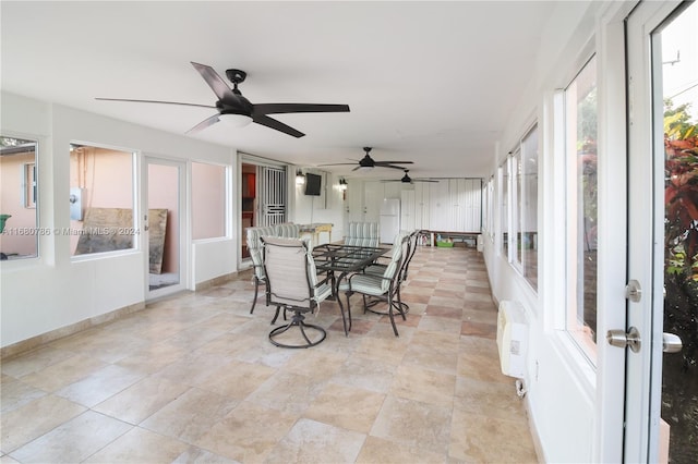 sunroom / solarium with ceiling fan