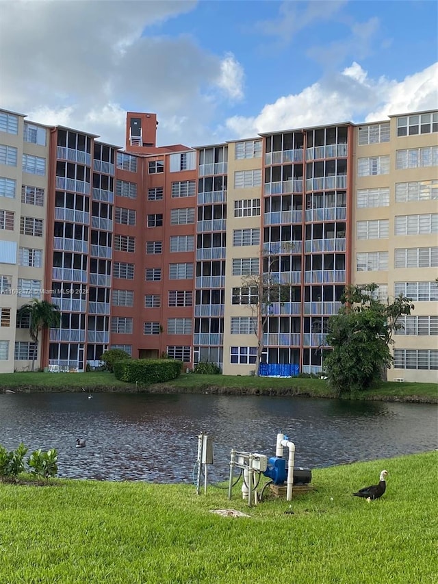 view of building exterior with a water view