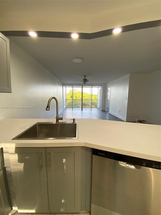 kitchen featuring sink, ceiling fan, and dishwasher