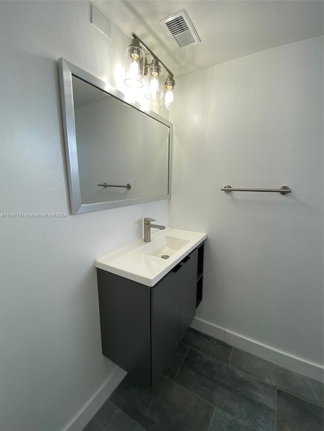 bathroom with vanity and tile patterned flooring