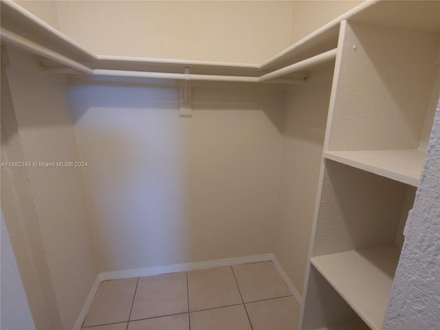 spacious closet featuring tile patterned flooring