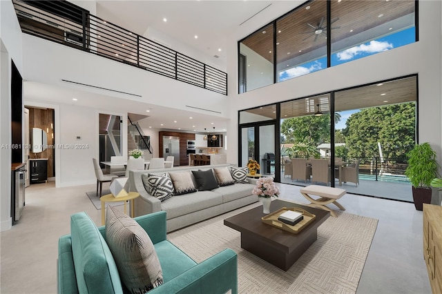 living room with a towering ceiling