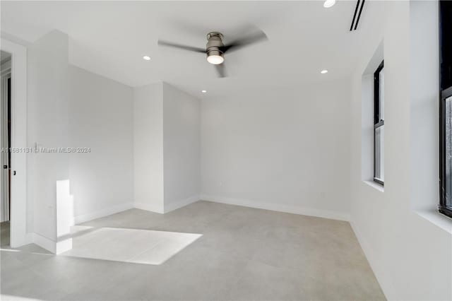 spare room with ceiling fan