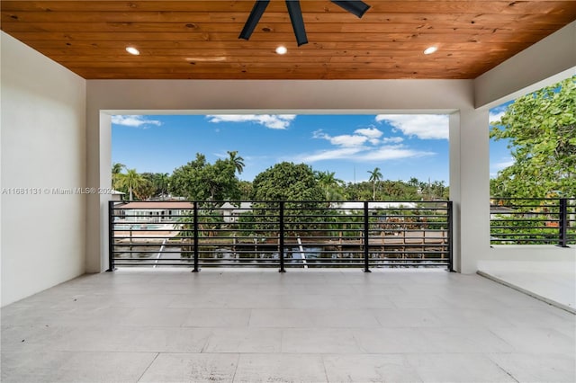 view of patio / terrace with ceiling fan and a balcony