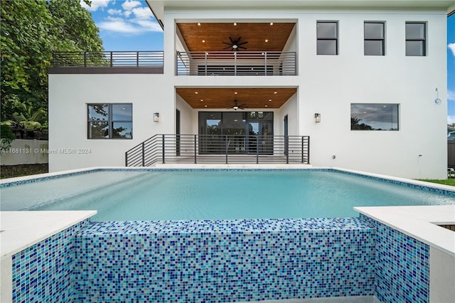 view of swimming pool with ceiling fan