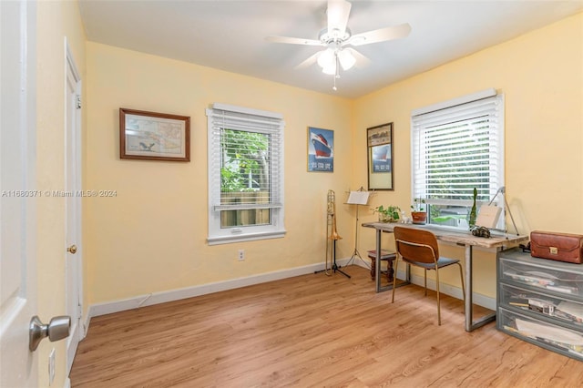 office space featuring light hardwood / wood-style flooring and ceiling fan