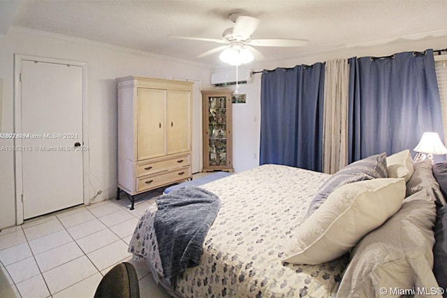 tiled bedroom featuring crown molding, an AC wall unit, and ceiling fan