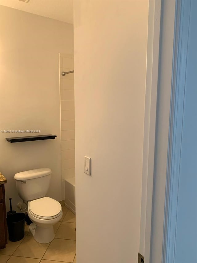 full bathroom with toilet, vanity, tile patterned floors, and shower / bathtub combination