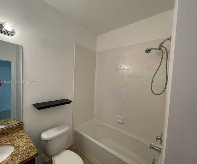 full bathroom featuring vanity, toilet, and tiled shower / bath