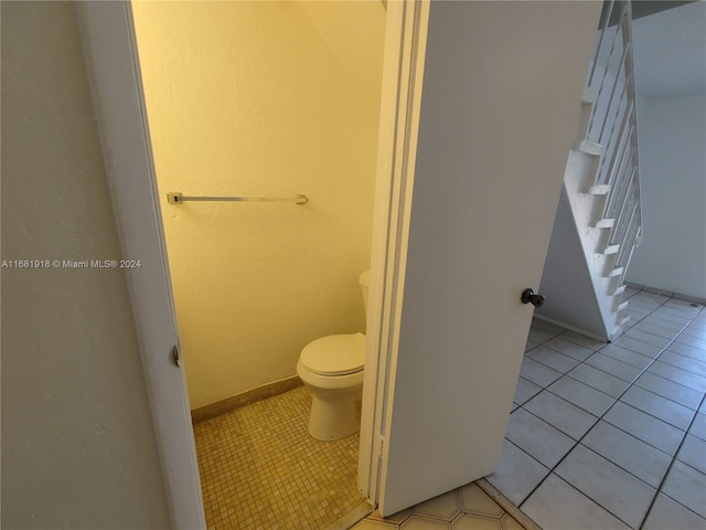 bathroom featuring tile patterned floors and toilet