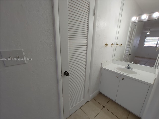 1305 W 53rd St Unit 410, Hialeah, FL 33012 - bathroom featuring tile patterned floors, vanity, a closet, and a textured wall