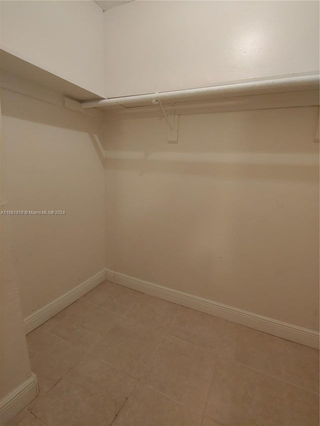 1305 W 53rd St Unit 410, Hialeah, FL 33012 - spacious closet with light tile patterned flooring
