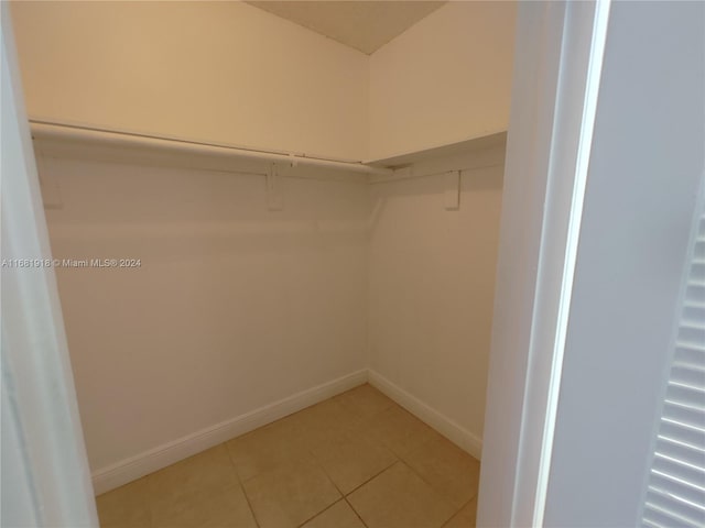 spacious closet featuring tile patterned floors